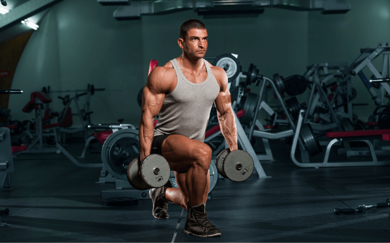 Image of a bodybuilder doing dumbbell lunges