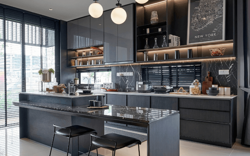 Your Dream Kitchen Come True: Design Trends & Ideas For Kitchen Spaces Image shot of a modern kitchen, with solid grey pieces and fancy kitchenware. The countertops are seen to be marble