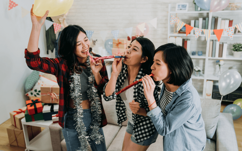 Takeout Vs. Home Cook: Which Option for Party Hosting is Right for You? An image of a house party