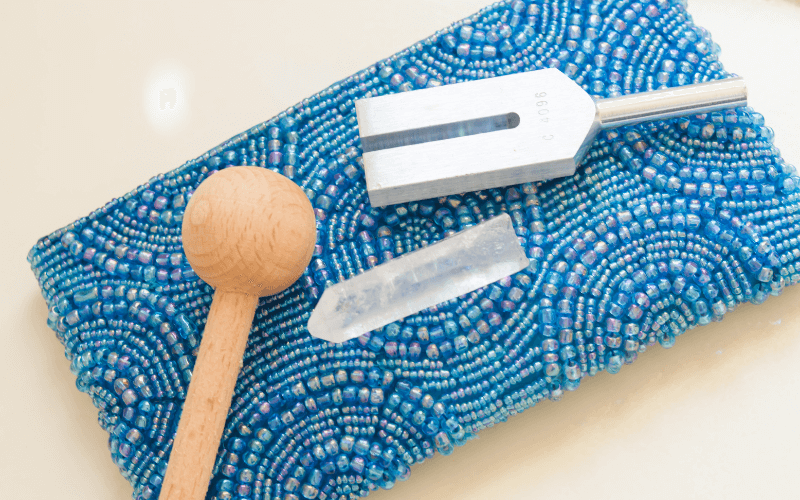 An image of singing bowls, gongs, and tuning forks
