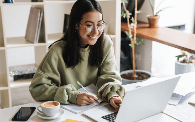 Image of a person looking at their laptop.