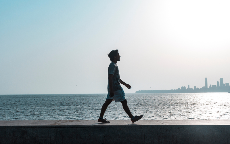 Why The Walking Trend Is Taking Over Singapore: A Wellness Revolution An image of a person brisk walking