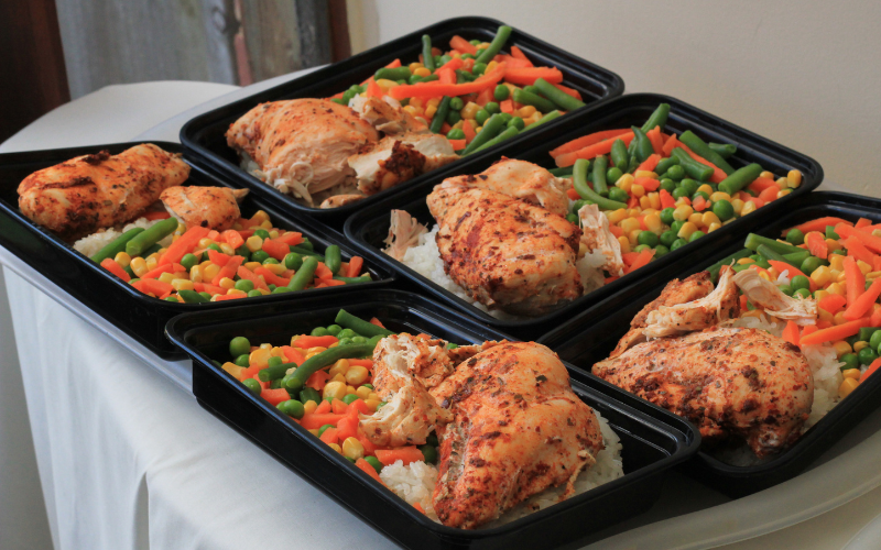 Image of a kitchen counter with several packed food meals