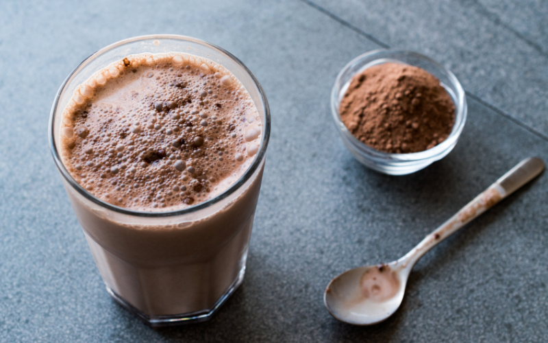 Easy & Healthy Protein Powder Recipes For A Nutritious Diet Image of a tub of protein powder and a protein shake