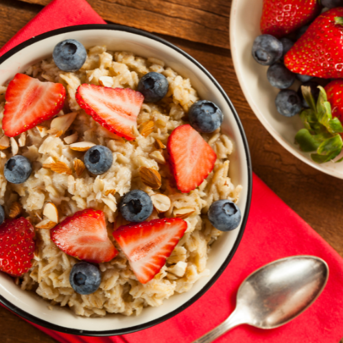 Small image of a bowl of oatmeal with nuts, fruits, and other toppings