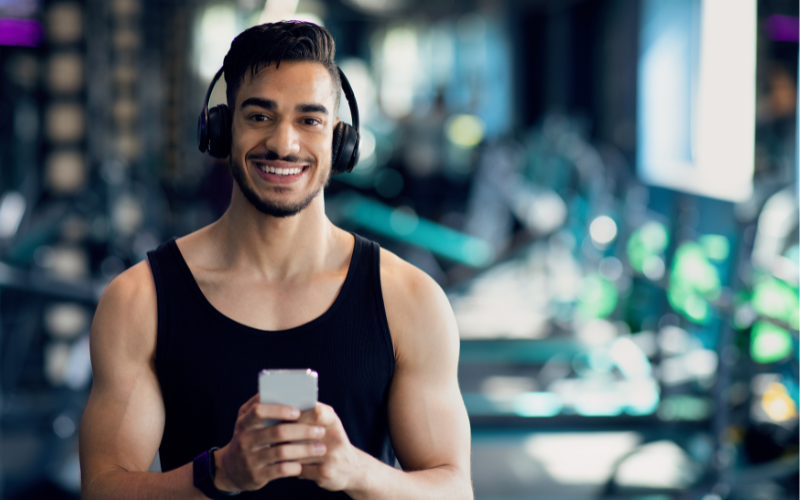 Image of a person in the gym with headphones
