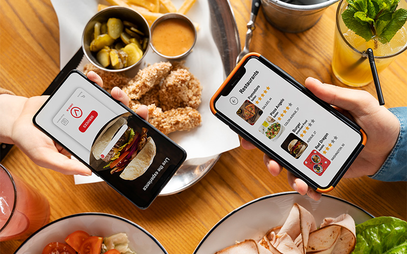 A stock photo of a person using a GrabFood-like app on their phone.
