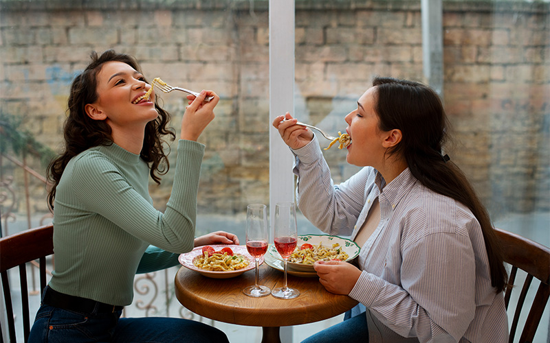 Diners enjoying a leisurely French meal with wine.