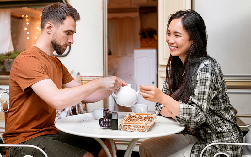 Two people sharing tea.