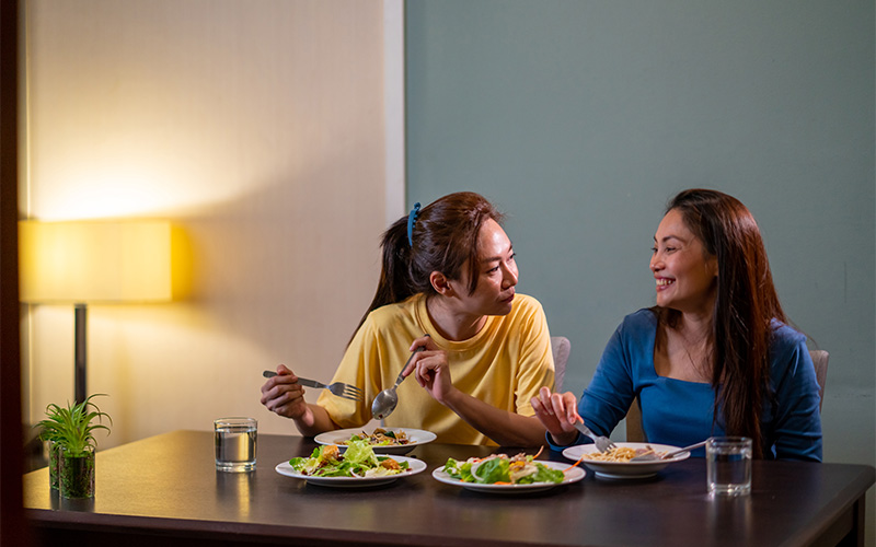 Two people sharing a meal in a dining area.