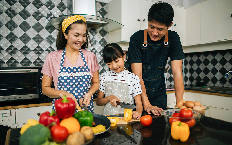 A family cooking a meal together