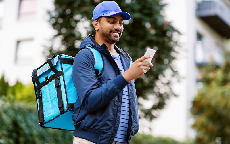 Image of a food delivery person checking their GPS