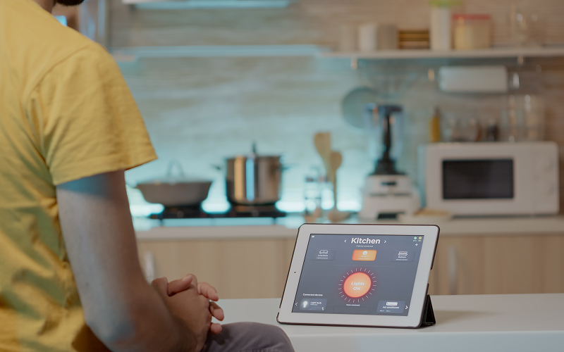 Image of a person checking a kitchen display system