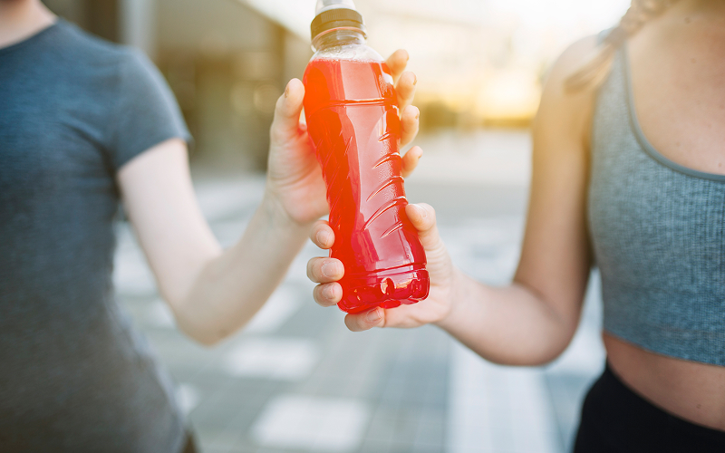 Image of an athlete drinking kombucha