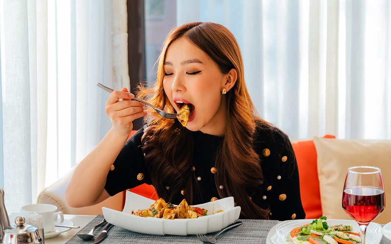 A stock photo related to a person eating a meal