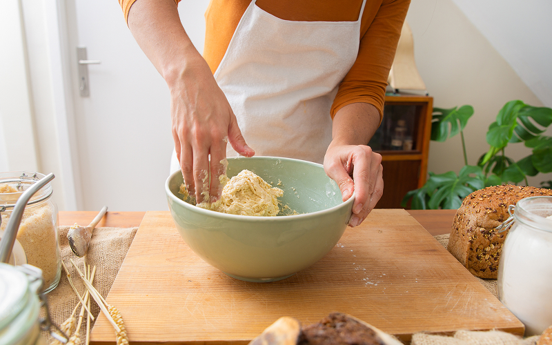 Image of a person making noodles.