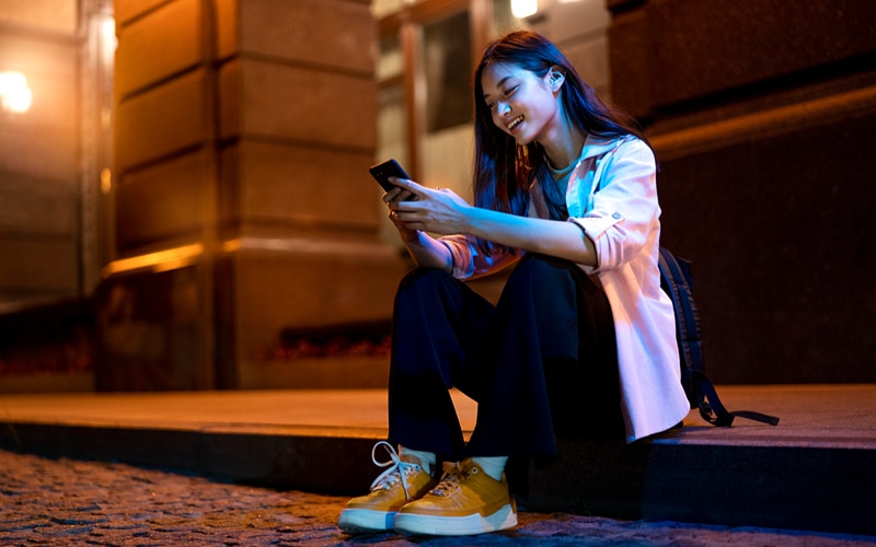 a person using hisher phone late night