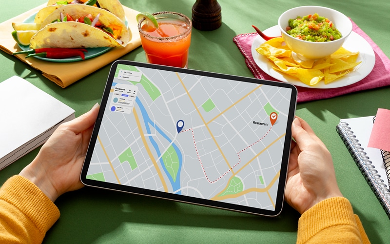 a phone showing a map indicating nearby food spot