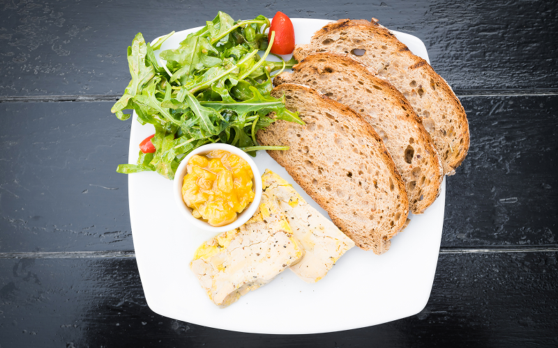 A plate of a healthy dish with whole-grain bread