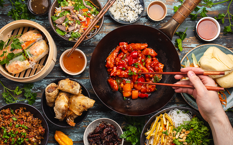 Best Food in Chinatown for Fit Folks Who Still Love a Good Bite Image of a table filled with Chinese food