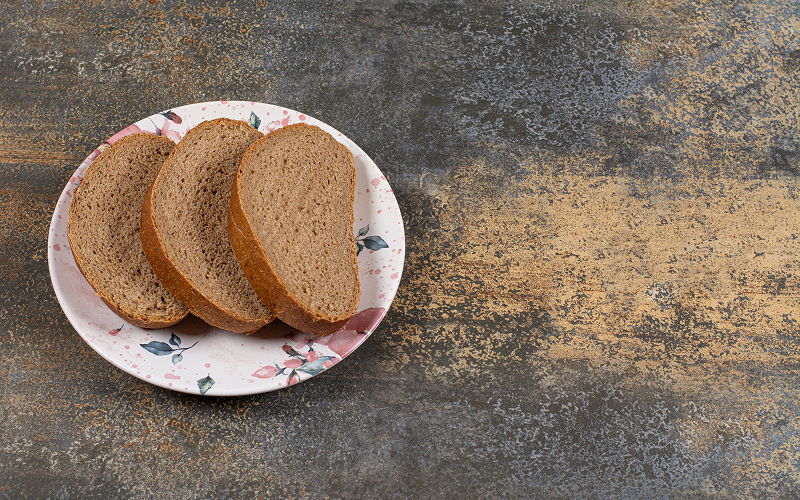 5 Reasons You Should Start Eating Whole-Grain Bread for Better Health Whole-grain bread on a plate