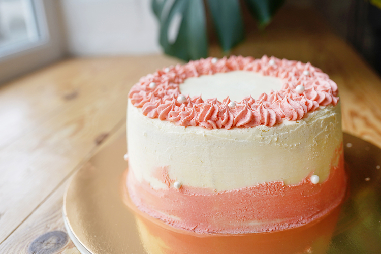 a slice of a simple-looking, minimal-frosted cake