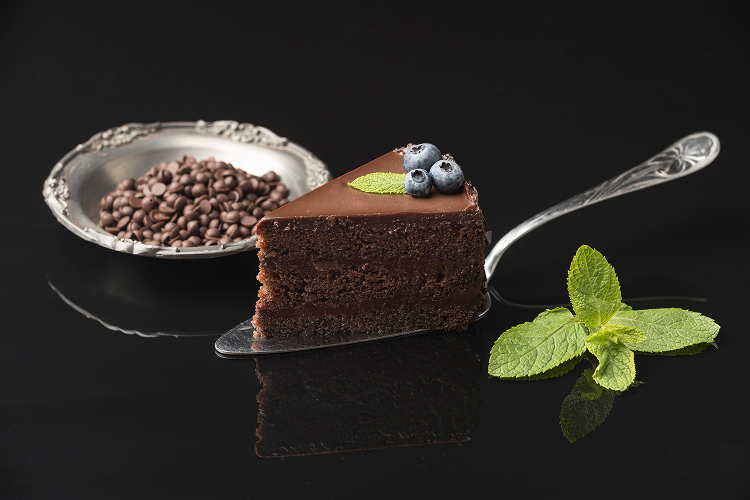 an appetising-looking slice of dark chocolate cake