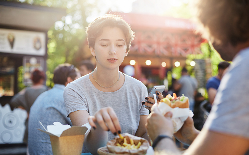 5 Portion Control Tips When Enjoying Meals at Hawker Centres A person eating at a hawker centre