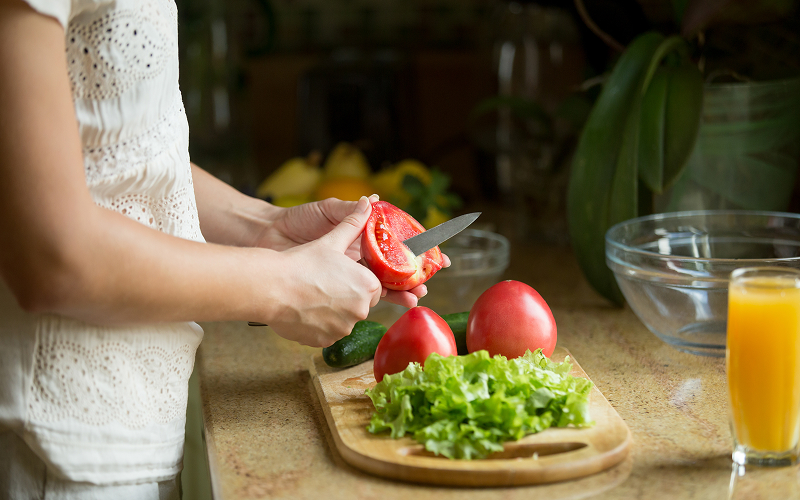 Fitness and Plants: A Quick Guide to High-Protein Meal Prep for Vegetarians in Singapore a fit person preparing vegetarian food at a kitchen