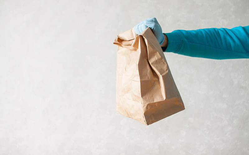 Image of a holding a food bag