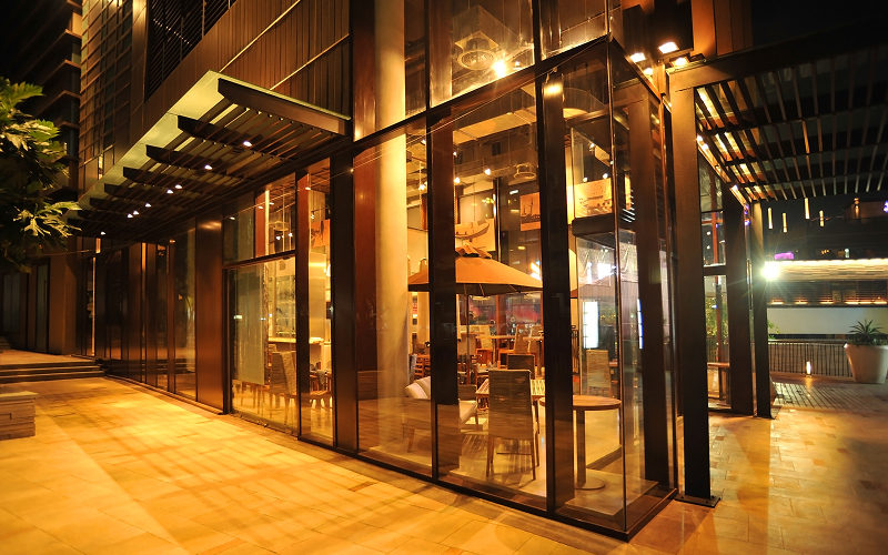 A facade of a cafe at night