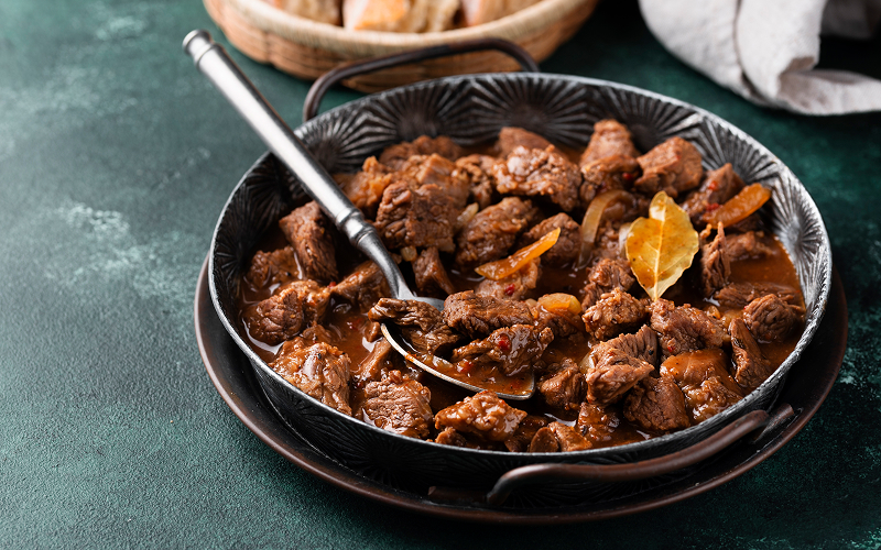a big bowl of beef rendang