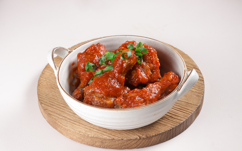 a big bowl of ayam masak merah